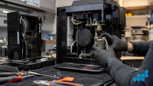 De'Longhi Magnifica Evo disassembled — pump and boiler repair
