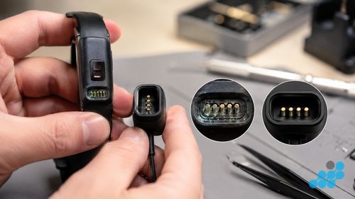 corroded Fitbit charging pins compared with a clean charger