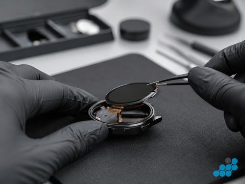 Cleaning Garmin watch charging contacts with a soft brush