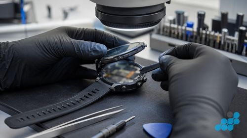 Opening a Garmin watch for screen repair under magnification