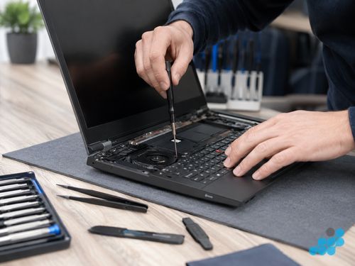 celltech technician working on a Lenovo ThinkPad laptop repair