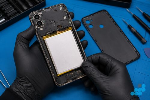 Moto G battery replacement — snap-fit rear panel removed to expose the cell