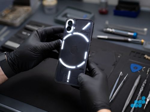 Nothing Phone (2) showing illuminated Glyph interface through the transparent back panel