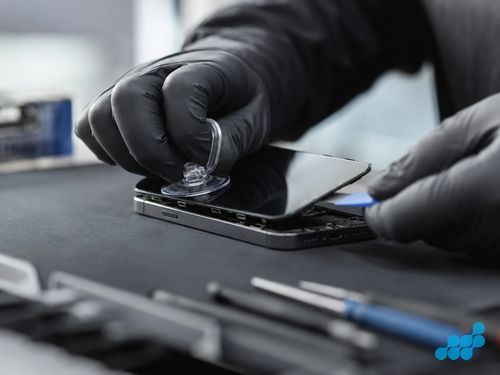 celltech technician separating a Nothing Phone OLED display during screen replacement