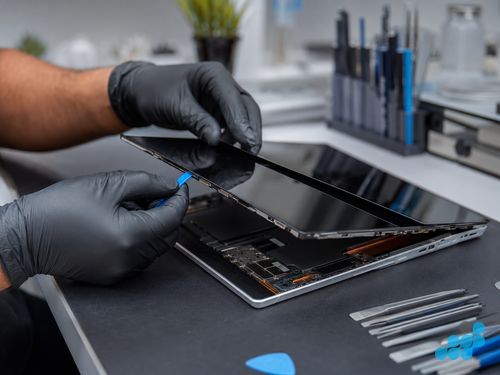Microsoft Surface Pro screen being separated from the fused chassis on the celltech bench